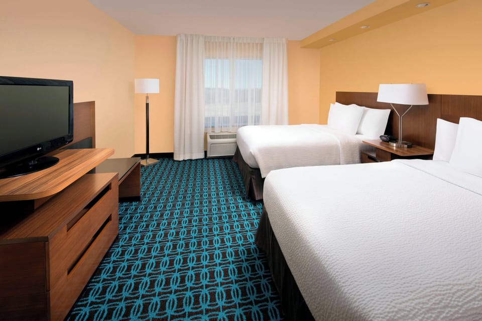 Down comforters, Select Comfort beds, in-room safe, desk