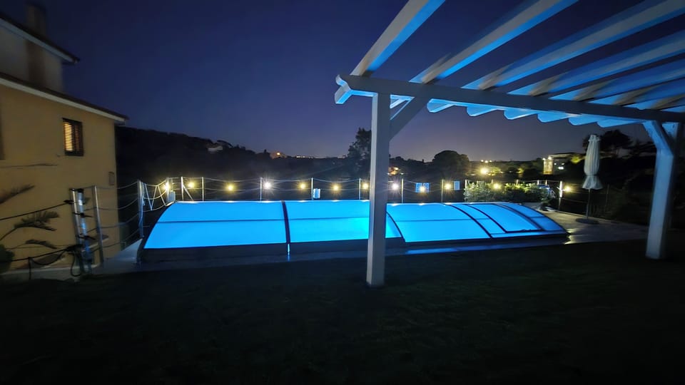 Seasonal outdoor pool, open 8:30 AM to 8:00 PM, pool umbrellas