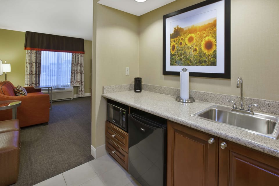 Desk, iron/ironing board, cribs (free), WiFi (free)