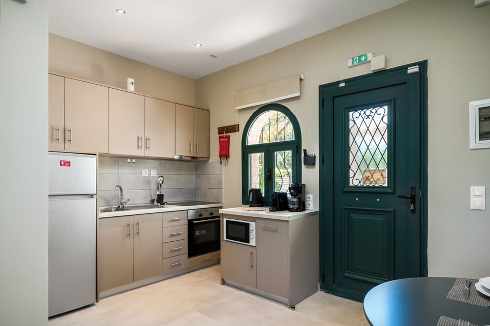 Luxury Villa, 1 Bedroom, Garden View (Gaia) | Private kitchen | Full-size fridge, microwave, oven, stovetop