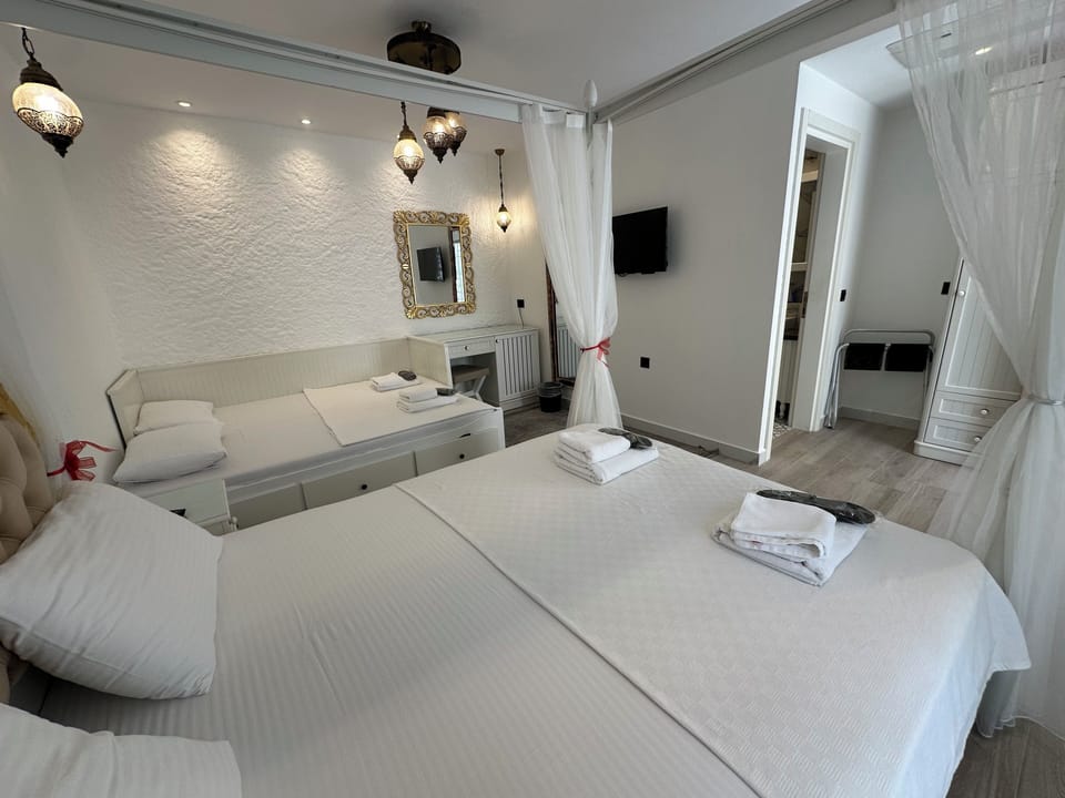 Quadruple Room, Garden View | Egyptian cotton sheets, premium bedding, minibar, in-room safe