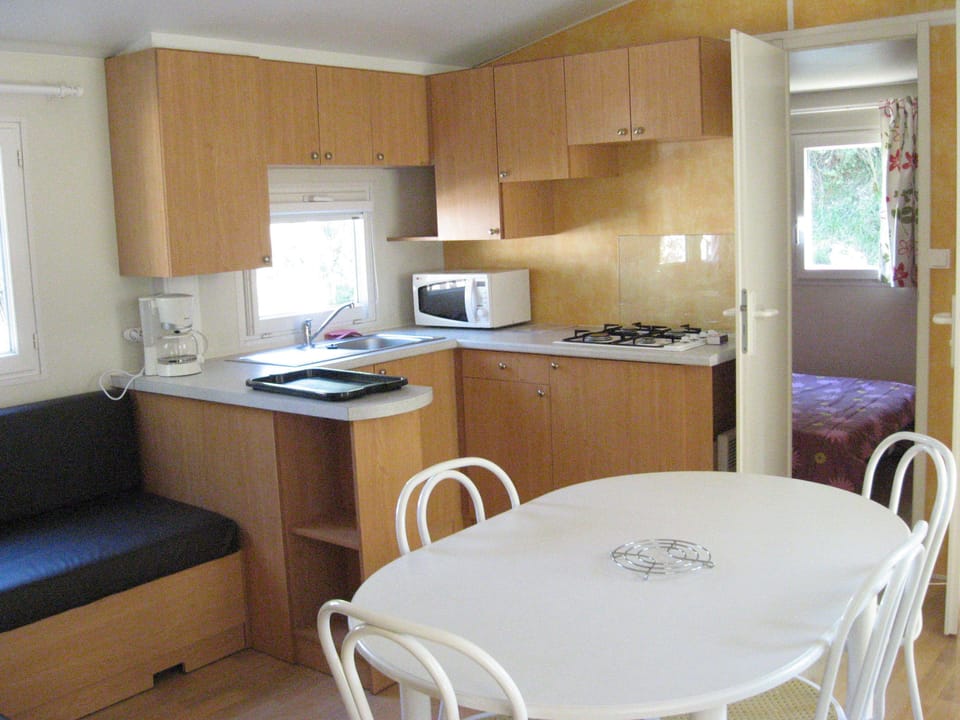 Basic Mobile Home, 2 Bedrooms | Private kitchenette | Full-size fridge, microwave, stovetop, cookware/dishes/utensils