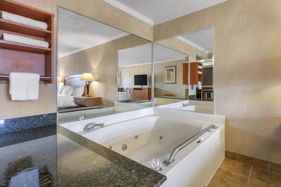 Suite, 1 King Bed, Accessible, Jetted Tub (with Sofabed) | Pillowtop beds, desk, laptop workspace, iron/ironing board