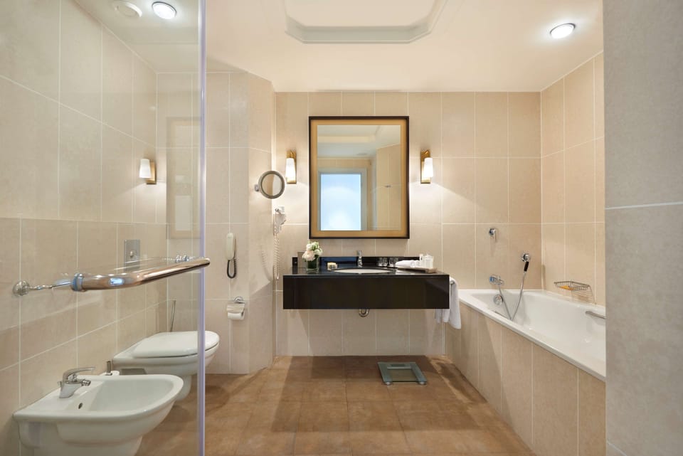 Separate tub and shower, designer toiletries, hair dryer, bathrobes