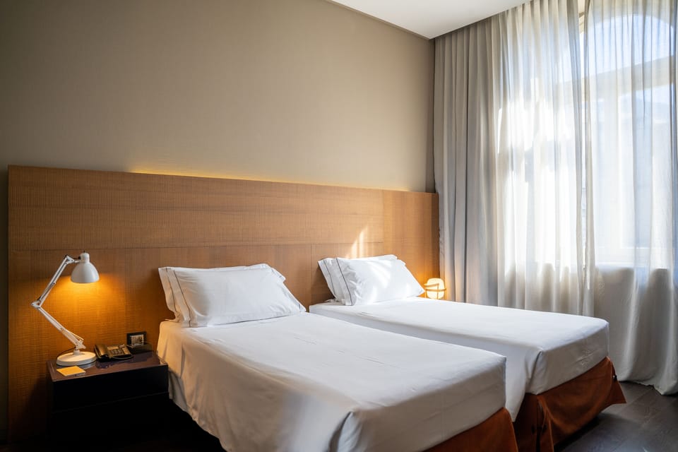 Premium bedding, down comforters, minibar, in-room safe