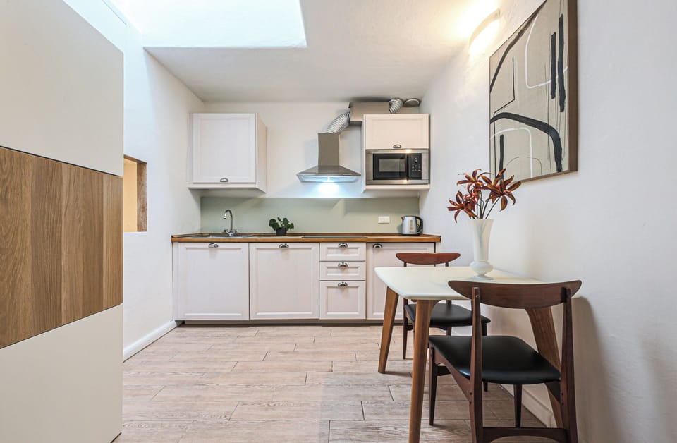 Apartment, 2 Bedrooms | Private kitchen | Fridge, microwave, stovetop, coffee/tea maker