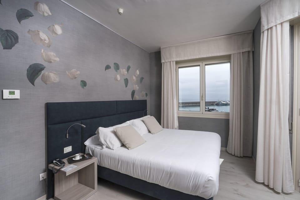 Deluxe Double Room, Balcony, Sea View | Down comforters, minibar, in-room safe, desk