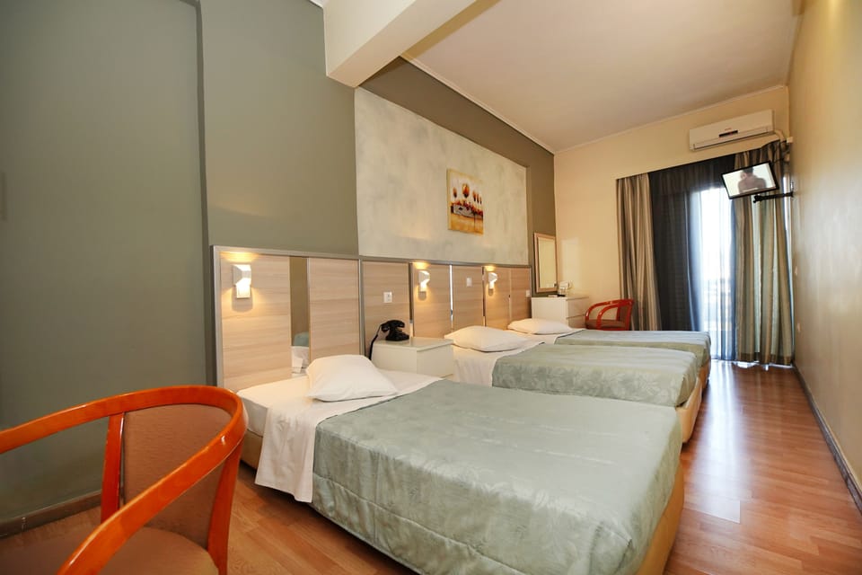 Triple Room (3 single beds) | In-room safe, desk, blackout drapes, soundproofing