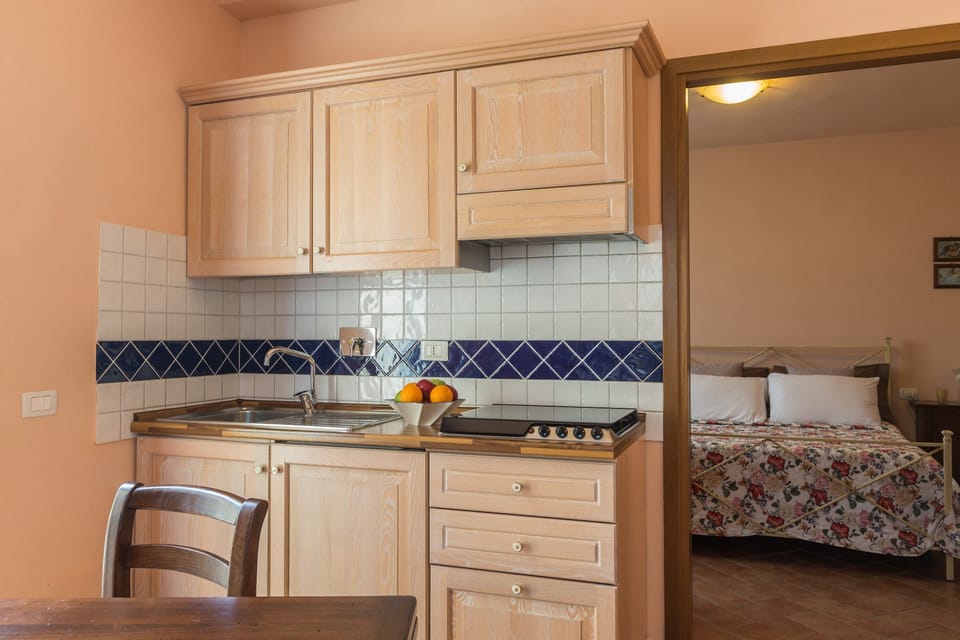 Comfort Apartment, Kitchenette | Private kitchenette | Full-size fridge, stovetop, espresso maker, coffee/tea maker