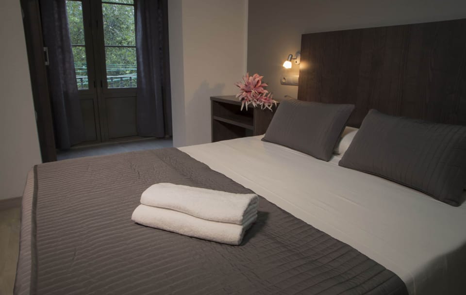 Family Quadruple Room, 2 Queen Beds | In-room safe, desk, laptop workspace, blackout drapes