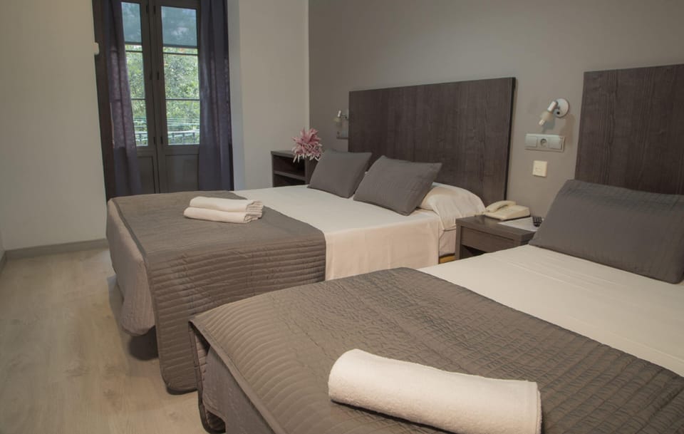 Family Quadruple Room, 2 Queen Beds | In-room safe, desk, laptop workspace, blackout drapes
