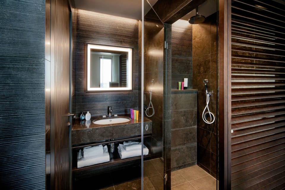 Deep soaking tub, rainfall showerhead, free toiletries, bidet