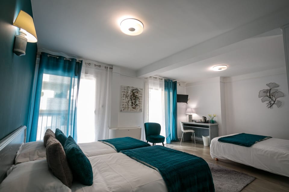 Comfort Quadruple Room | Premium bedding, in-room safe, desk, soundproofing