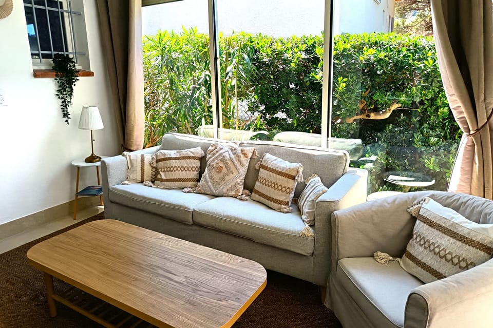 Family Suite, Garden View | Living area | Flat-screen TV