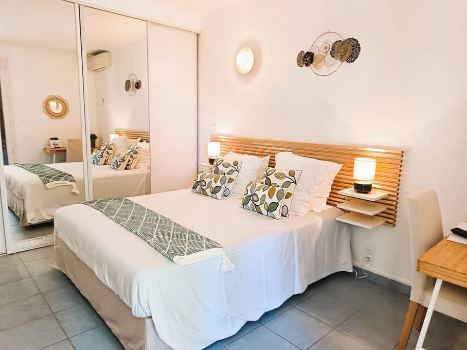 Family Suite, Garden View | Individually decorated, desk, laptop workspace, blackout drapes