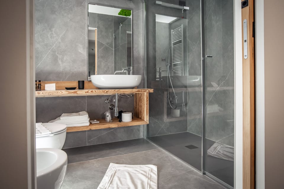 Designer toiletries, hair dryer, bathrobes, slippers