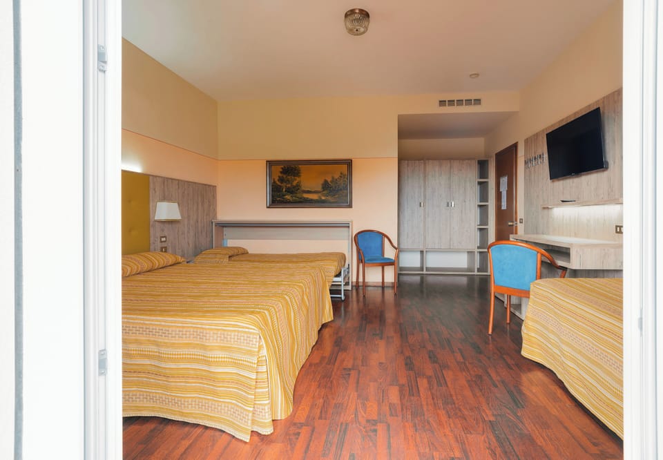 Comfort Quadruple Room, Non Smoking, Garden View | In-room safe, individually furnished, desk, blackout drapes