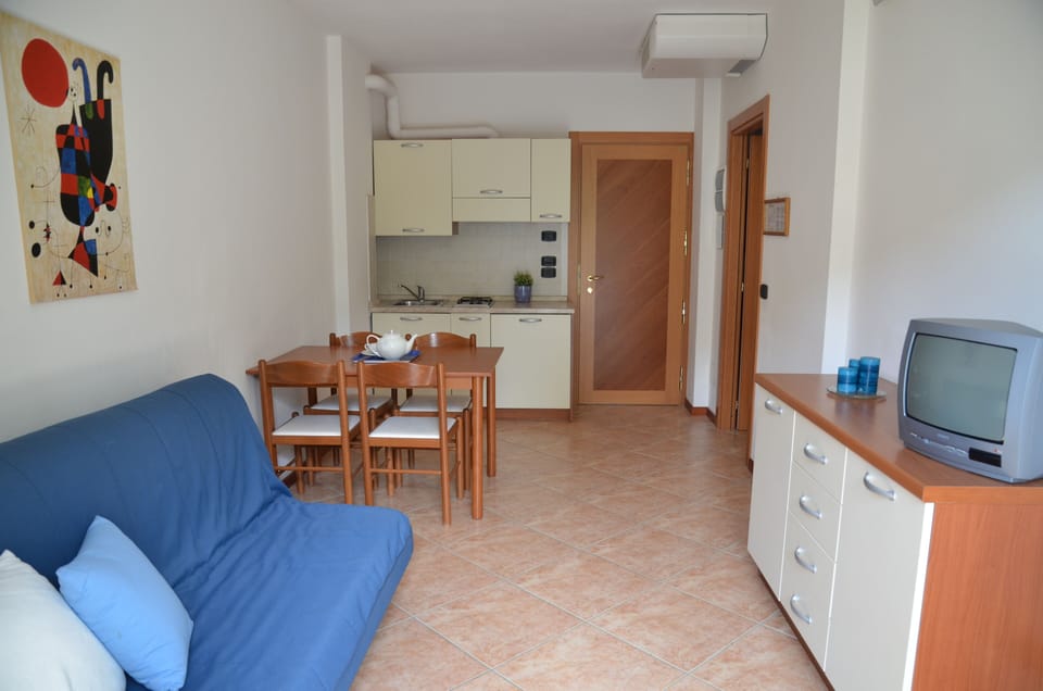 Family Apartment, Balcony | Living area | Flat-screen TV