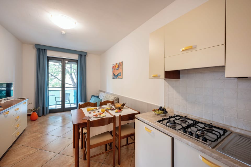 Family Apartment, Balcony | Living area | Flat-screen TV
