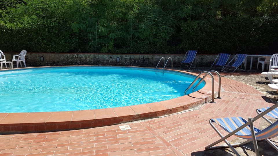 Seasonal outdoor pool, pool umbrellas, sun loungers