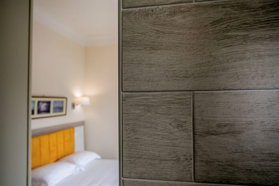 Family Room, City View | Minibar, in-room safe, blackout drapes, soundproofing