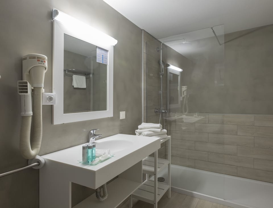 Shower, eco-friendly toiletries, hair dryer, slippers