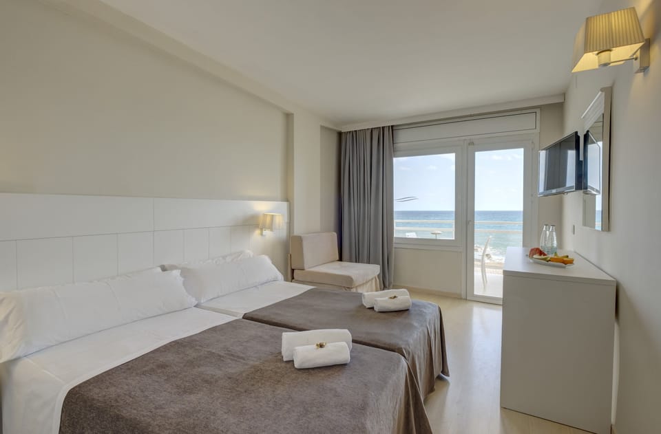 Double or Twin Room, Balcony, Sea View | Down comforters, in-room safe, desk, blackout drapes