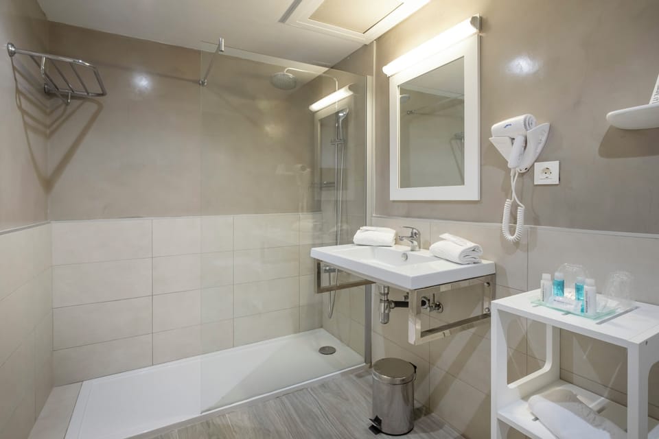 Shower, eco-friendly toiletries, hair dryer, slippers