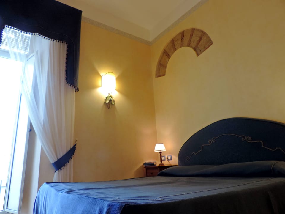 Triple Room, Private Bathroom | In-room safe, individually furnished, desk, soundproofing