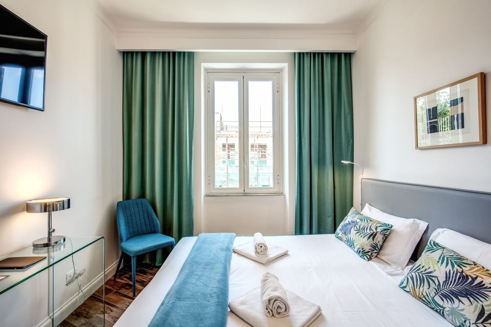 Twin Room | Minibar, in-room safe, desk, iron/ironing board