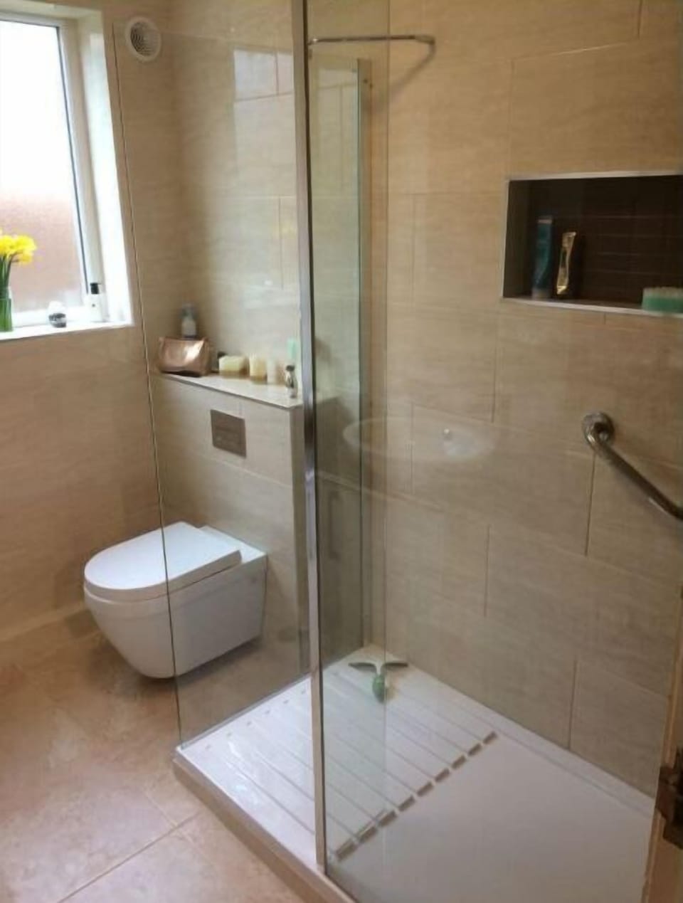 Shower, hair dryer, slippers, towels
