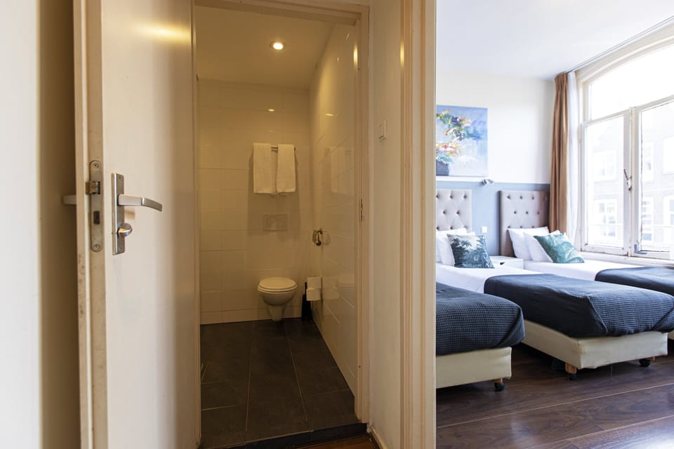 Standard Triple Room, 3 Twin Beds, Private Bathroom (some rooms situated in the basement) | Room amenity