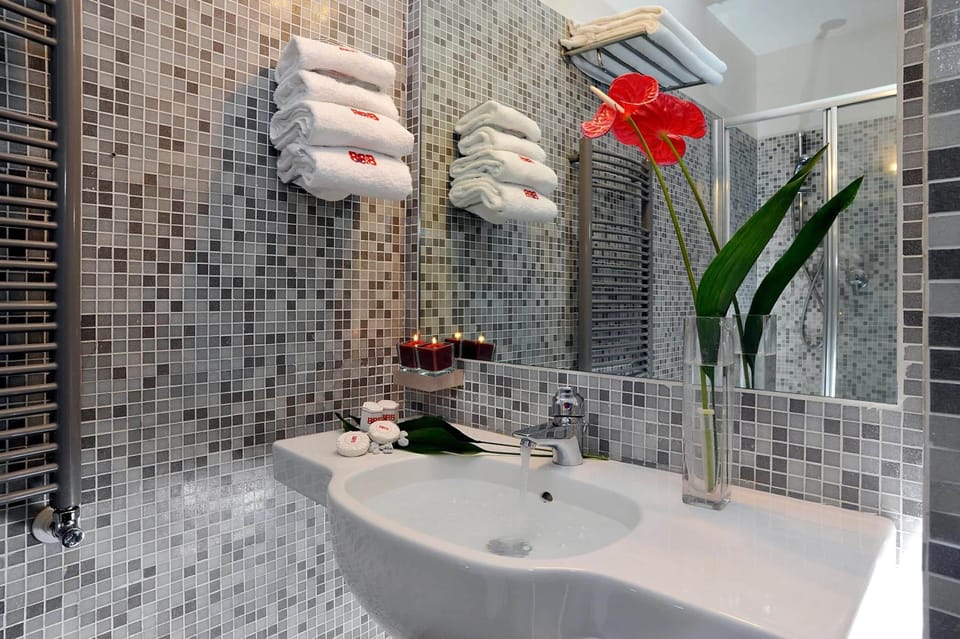 Shower, designer toiletries, hair dryer, bidet