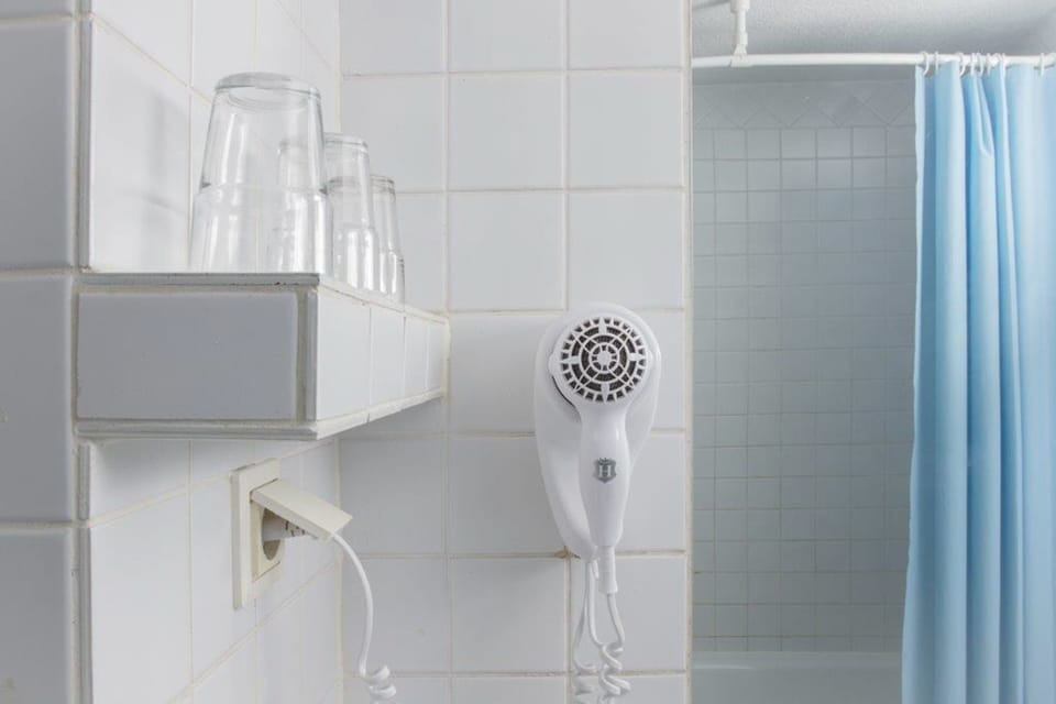 Shower, hair dryer, towels