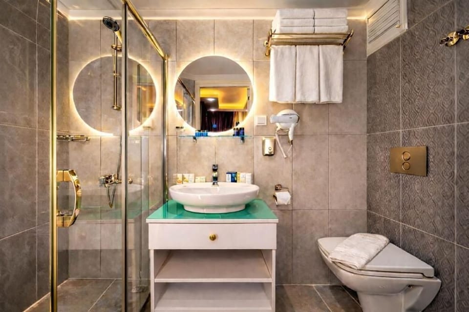 Shower, eco-friendly toiletries, hair dryer, slippers