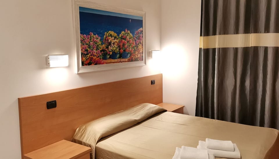 Economy Double Room | Down comforters, minibar, in-room safe, desk