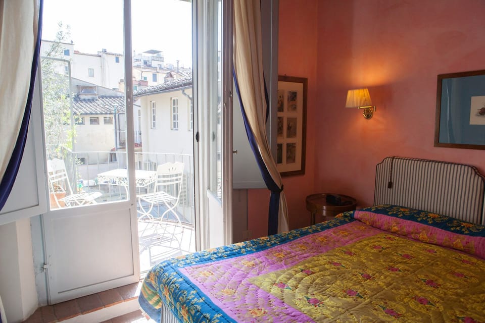 Deluxe Double Room | Minibar, in-room safe, desk, blackout drapes