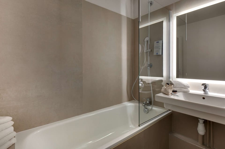 Eco-friendly toiletries, hair dryer, towels