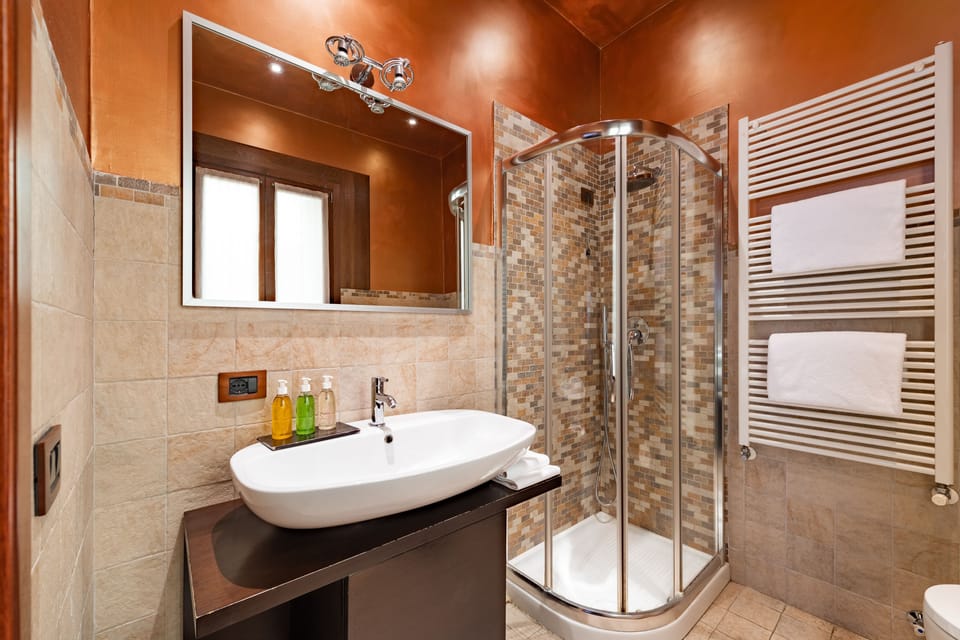 Suite, City View | Bathroom | Hydromassage showerhead, hair dryer, bidet, towels