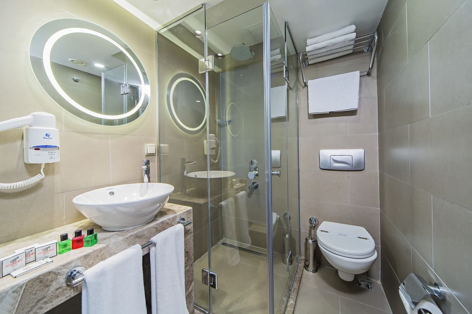 Shower, free toiletries, hair dryer, slippers