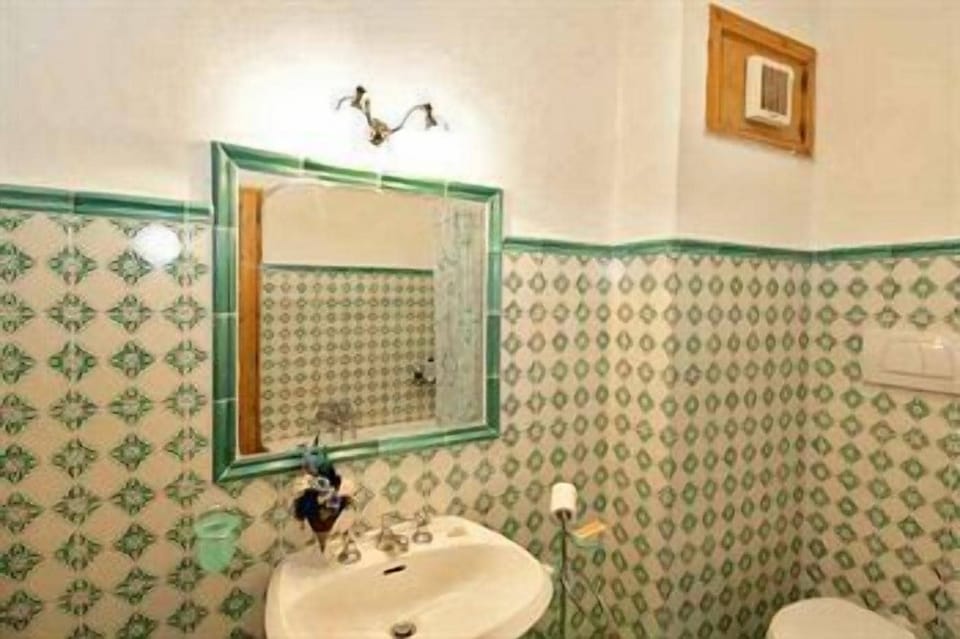 Shower, hair dryer, slippers, towels
