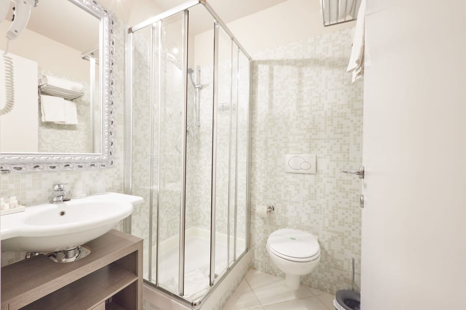 Shower, free toiletries, hair dryer, towels