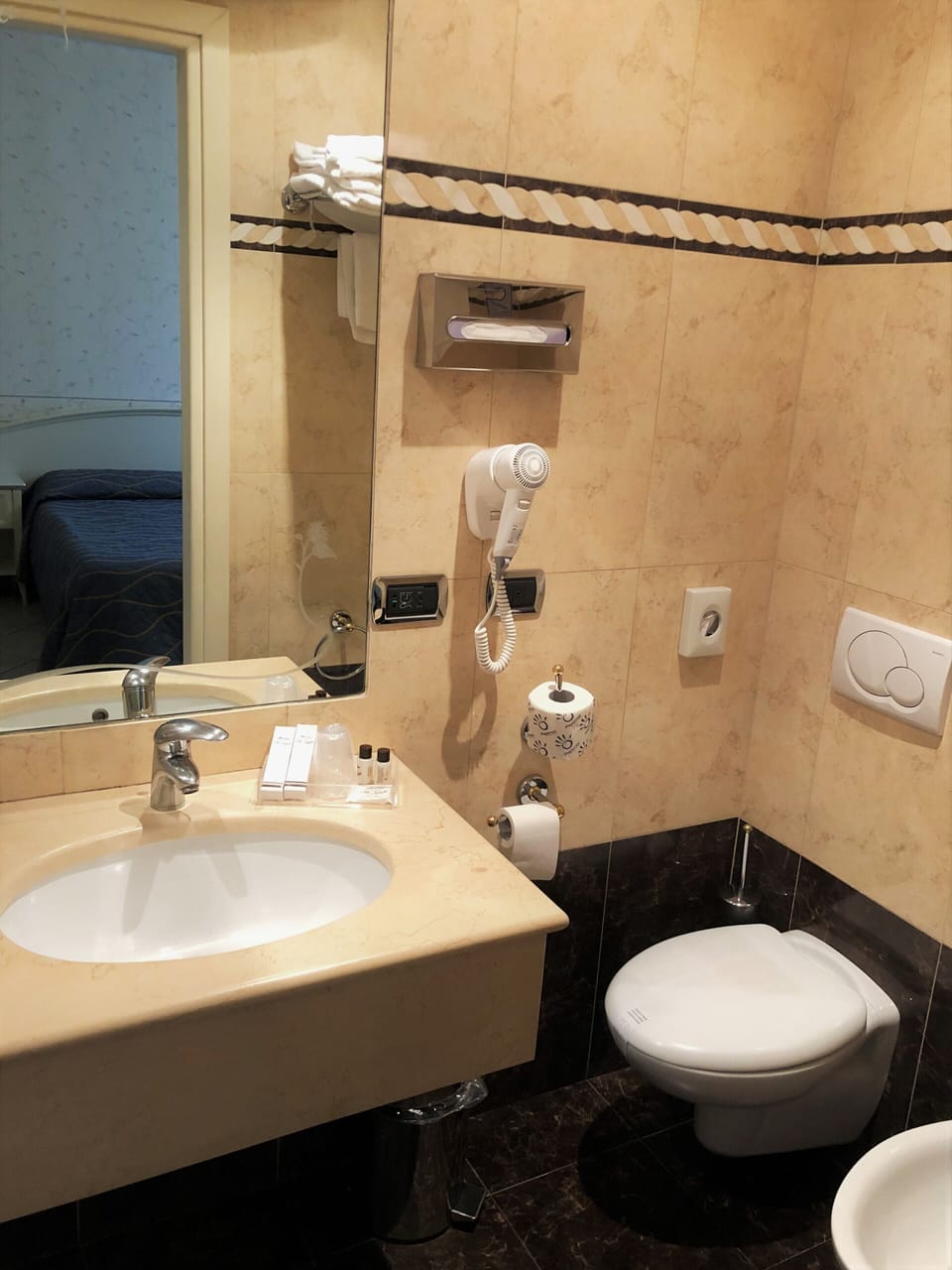 Combined shower/tub, hair dryer, slippers, bidet