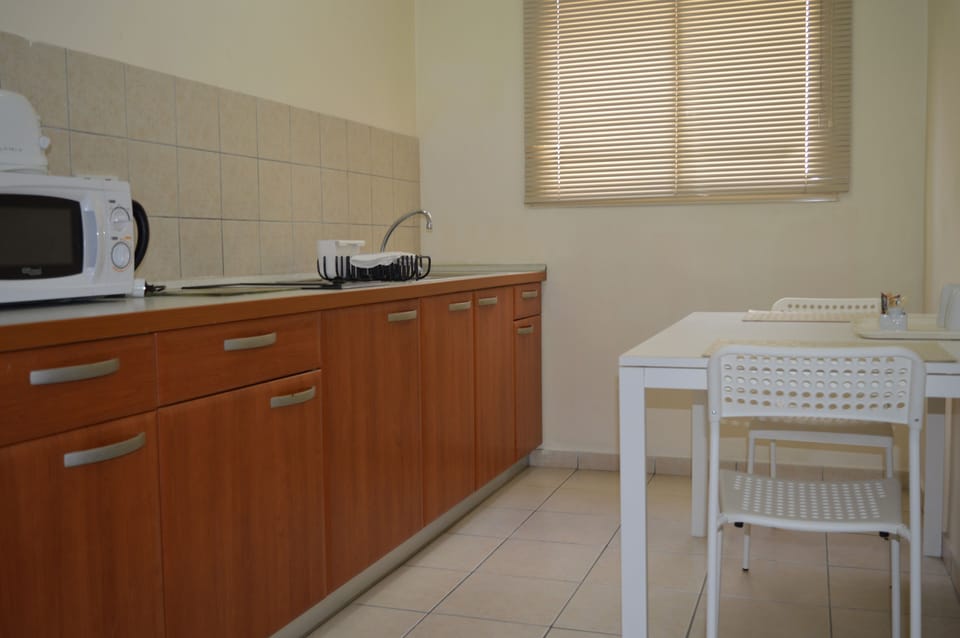 Apartment, 2 Bedrooms | Private kitchen | Coffee/tea maker, fridge, microwave, cookware/dishes/utensils