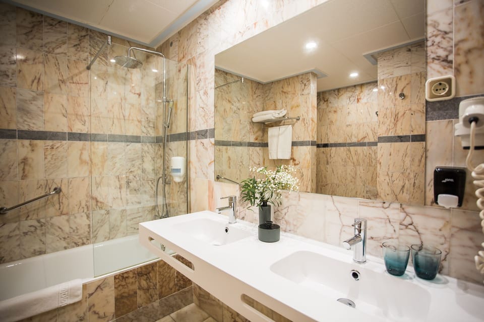 Hair dryer, towels, soap, shampoo