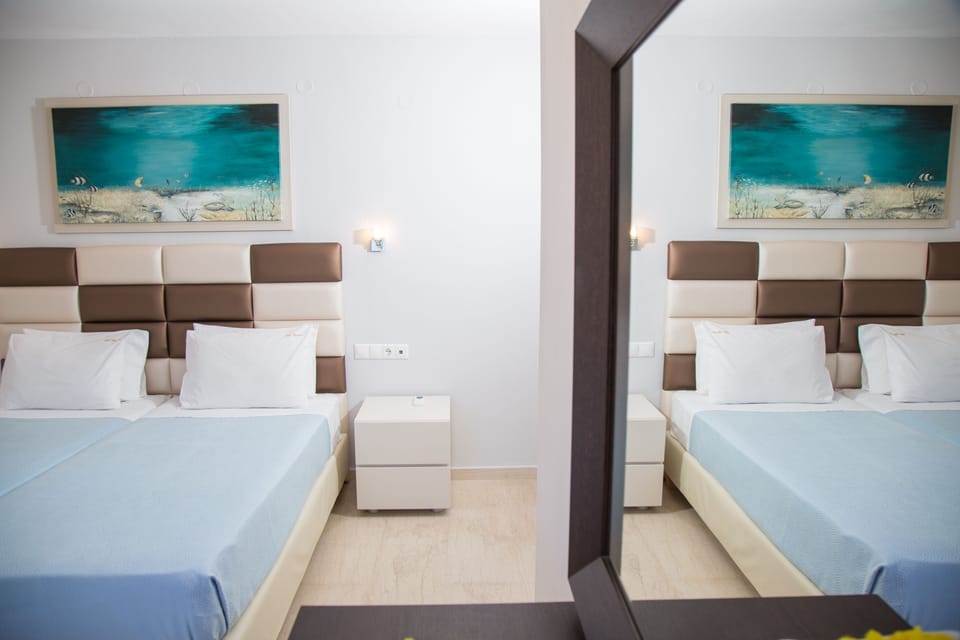Family Apartment, 2 Bedrooms | Pillowtop beds, in-room safe, individually furnished, free WiFi