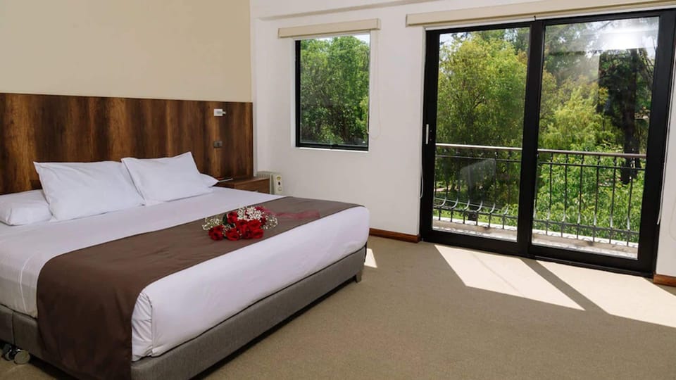 Studio Suite, Garden View, Garden Area | Down comforters, minibar, in-room safe, individually decorated