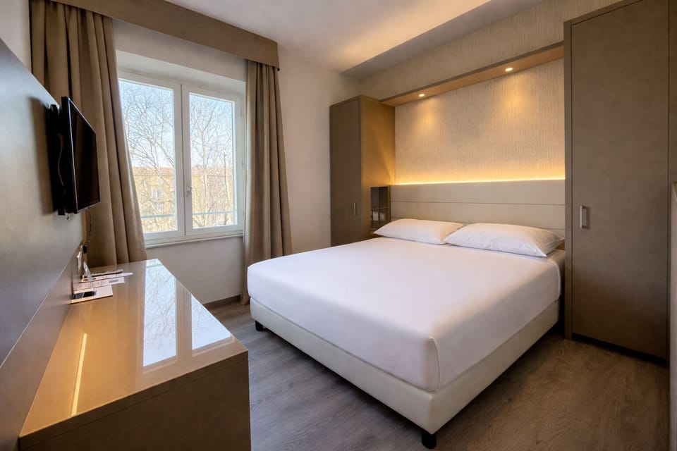 Superior Double or Twin Room | Minibar, in-room safe, desk, blackout drapes