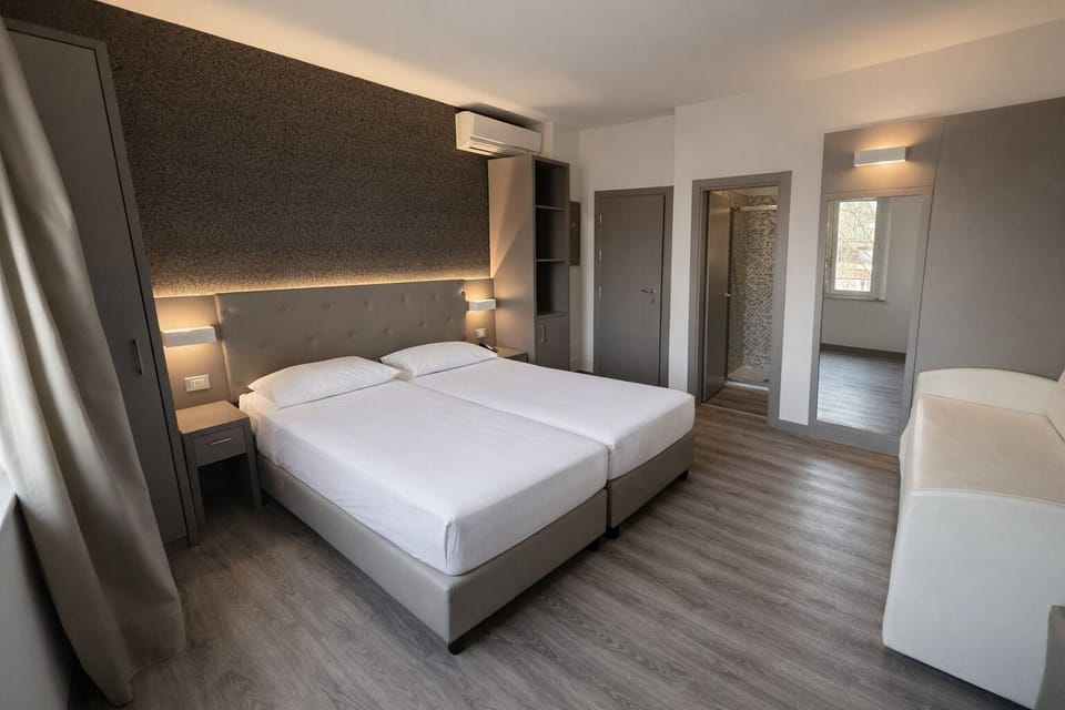 Superior Quadruple Room | Minibar, in-room safe, desk, blackout drapes
