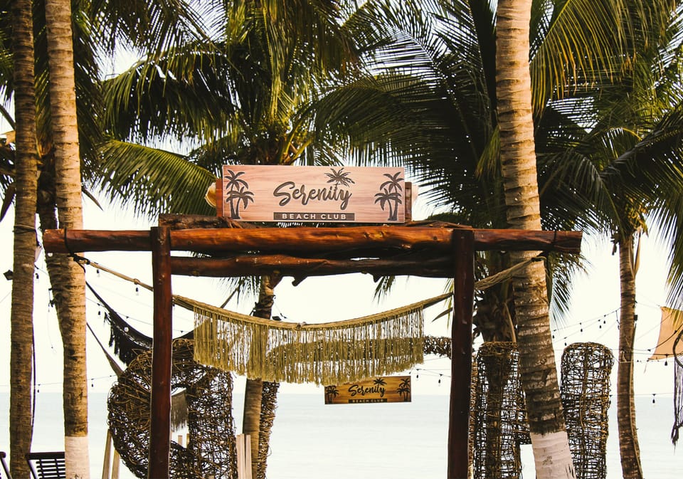 On the beach, white sand, sun loungers, beach towels